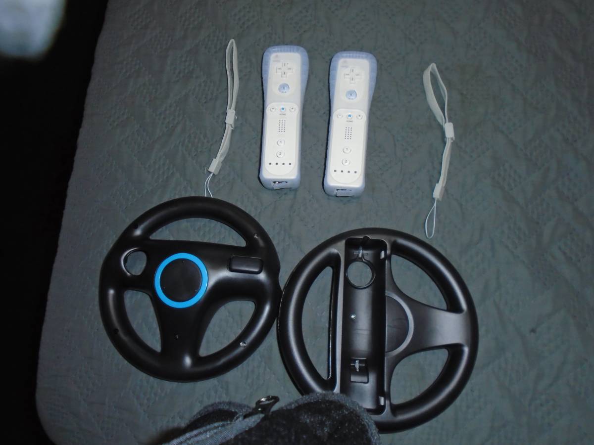 new 2 wii controllers /2 steering wheels