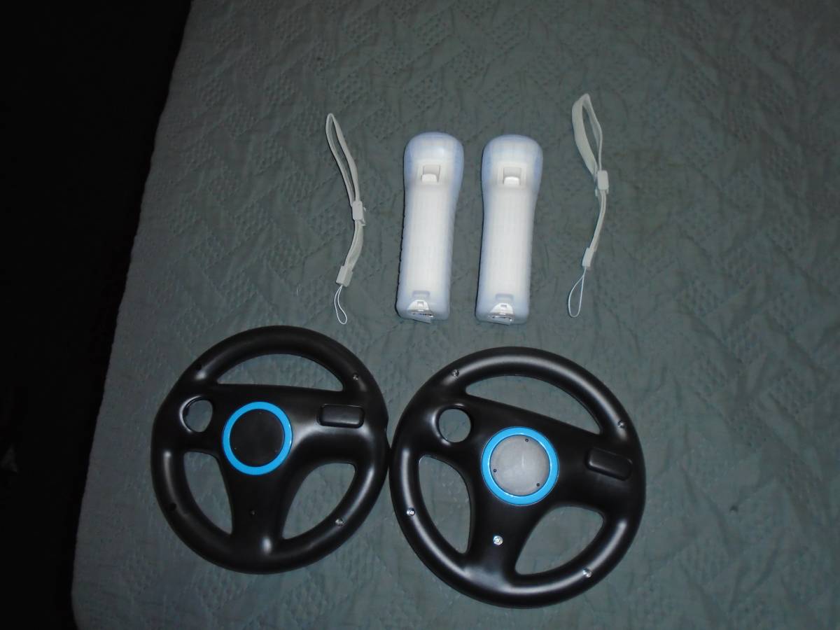 new 2 wii controllers /2 steering wheels