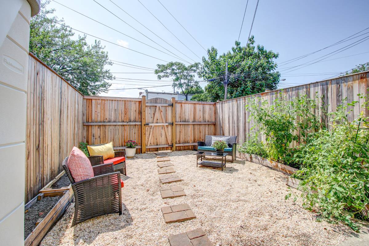 Large 4BR/2.5BA rowhouse w/ 2 off-street parking spaces & fenced patio