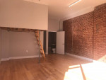 Live - work, renovated duplex storefront with rolling gate