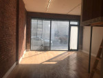 Live - work, renovated duplex storefront with rolling gate