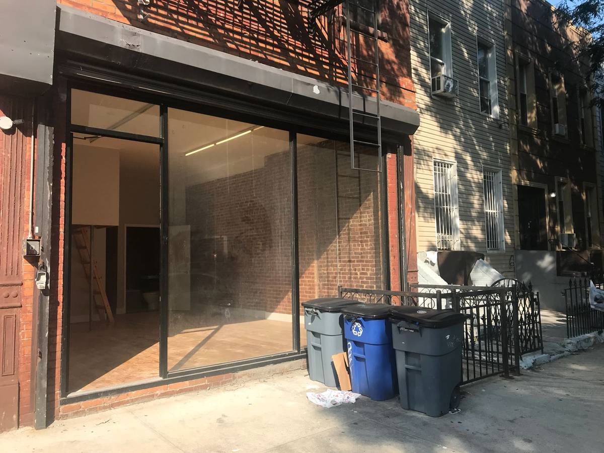 Live - work, renovated duplex storefront with rolling gate
