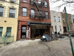 Live - work, renovated duplex storefront with rolling gate