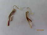 7 gold tone dangly earrings and 1 necklace