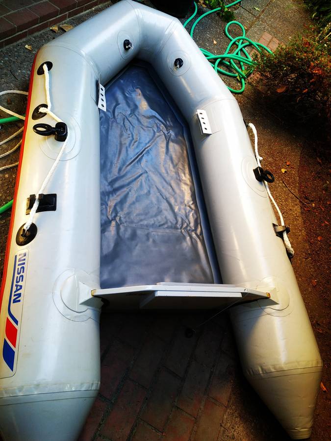 Nissan 8 feet inflatable with 2.5 HP outboard motor and all boating ac